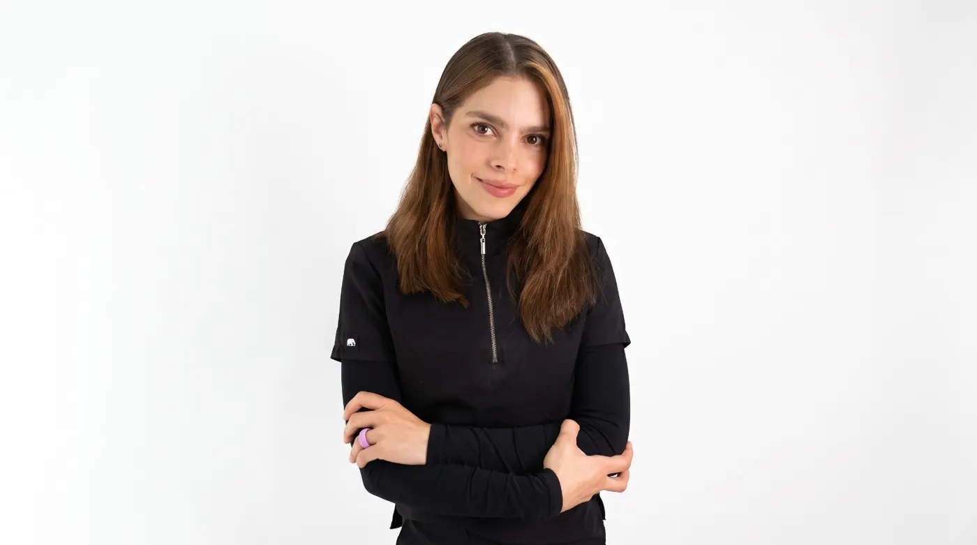 Dr. Laura Salazar, arms crossed, smiling